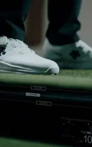 The hitting plate tilting under a player’s feet mid-stance.