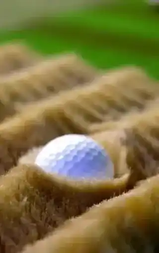 The surface under the ball changing between fairway, rough and sand.